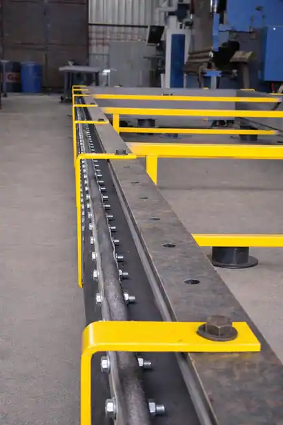 Long rectangular fabric expansion joint with yellow support frame in a manufacturing facility