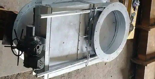 Side view of an industrial guillotine damper with a slide gate plate mechanism and motorized actuator drive