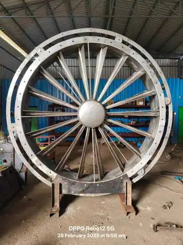 Front close-up view of a circular adjustable inlet guide vane damper assembly for airflow control
